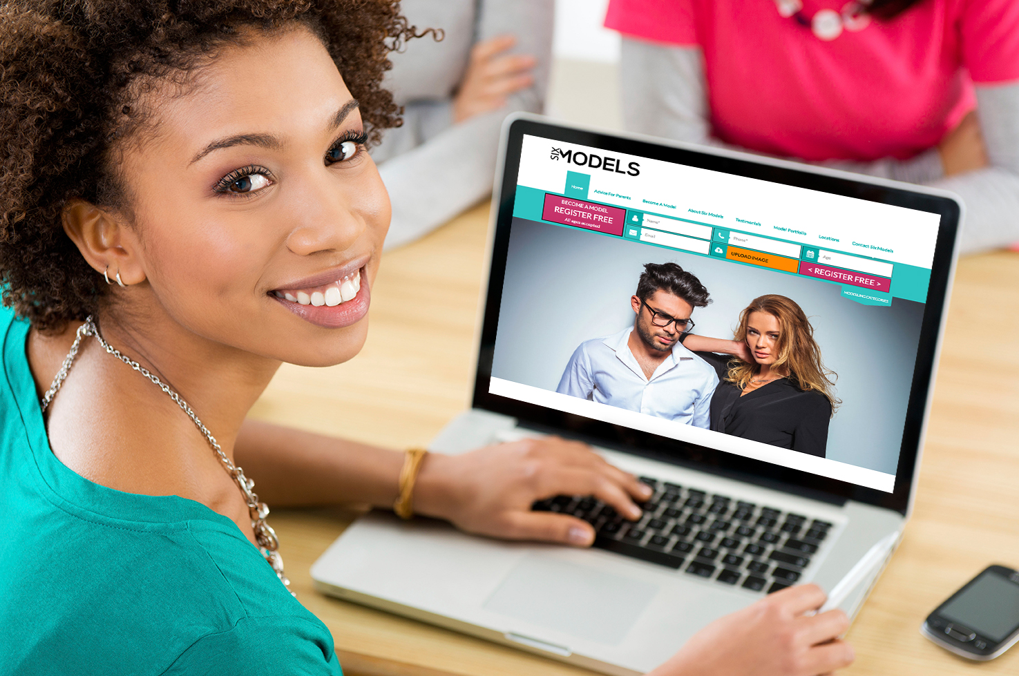 make Beautiful woman holding laptop with your website